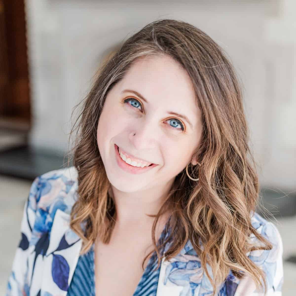 Cait Potter in a floral blazer, smiling